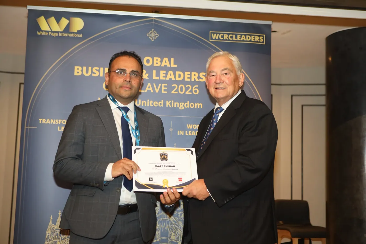 Raj Sandhan receiving his recognition certificate at the Global Business & Leaders Conclave 2026 in London
